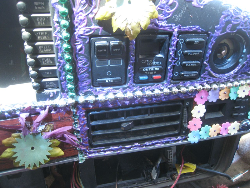 Illustration for article titled Groovalicious Purple Princess Of Peace Art Car Falls On Hard Times, Faces Crusher
